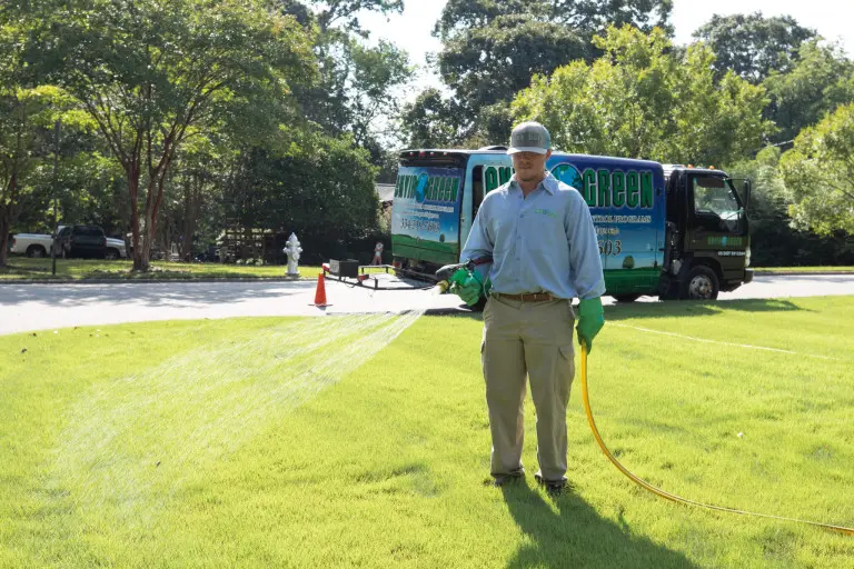 technician spraying lawn